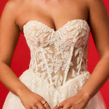 Sweetheart neckline with nude bodice and white lace wedding dress.