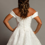 Off the shoulder lace all over ballgown wedding dress with a corset back