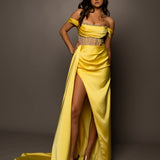 Bright yellow satin column dress with off the shoulder and high slit