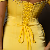 Bright yellow satin column dress with off the shoulder and high slit