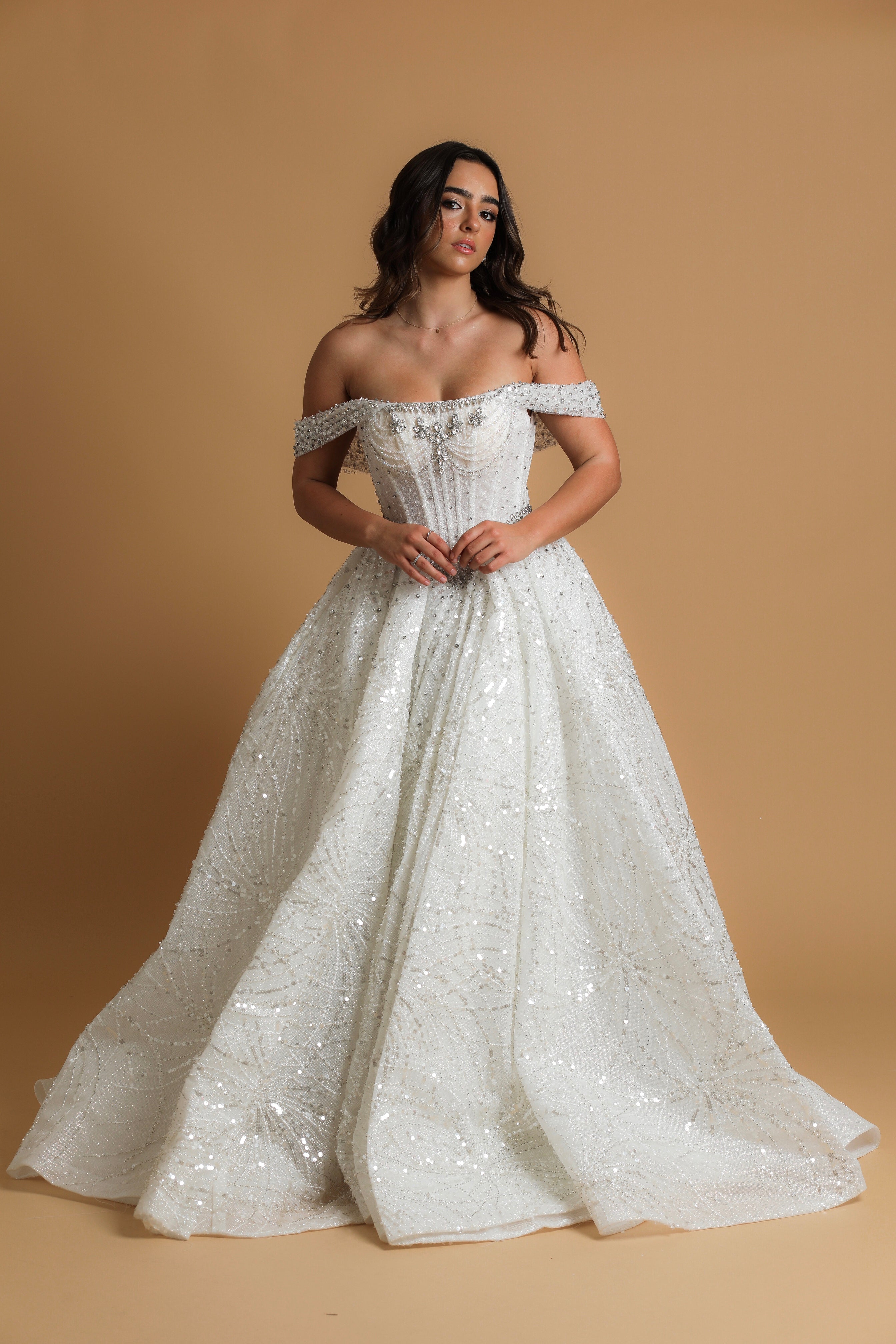 Off the shoulder ballgown wedding dress with a corset back