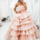 Nudish pink with a bushier top and a bushier puffy layered skirt.