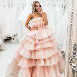 Nudish pink with a bushier top and a bushier puffy layered skirt.