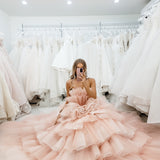 Nudish pink with a bushier top and a bushier puffy layered skirt.