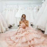 Nudish pink with a bushier top and a bushier puffy layered skirt.