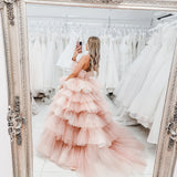Nudish pink with a bushier top and a bushier puffy layered skirt.
