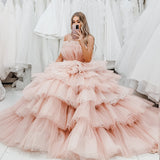 Nudish pink with a bushier top and a bushier puffy layered skirt.