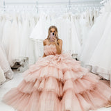 Nudish pink with a bushier top and a bushier puffy layered skirt.