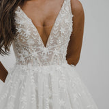 Sparkling white V neck wedding dress with open back for hire