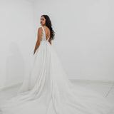 Sparkling white V neck wedding dress with open back for hire