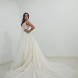 Sparkling white V neck wedding dress with open back for hire