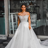 White sweet heart neckline wedding dress with a stiff pleated tulle in front princess dress