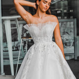 White sweet heart neckline wedding dress with a stiff pleated tulle in front princess dress