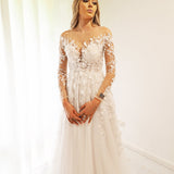 White Flowery Tulle Wedding Dress with sleeves for hire.