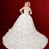 ballgown wedding dress with floral lace and detachable romantic sleeves.