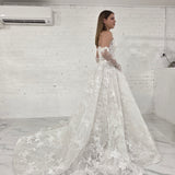 pearl-detailed lace ballgown with ethereal sleeves and regal bridal elegance.