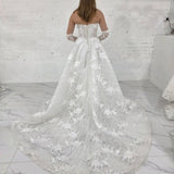 pearl-detailed lace ballgown with ethereal sleeves and regal bridal elegance.