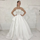 satin wedding gown with sparkling lace, elegant draping, and enchanting peekaboo details for hire