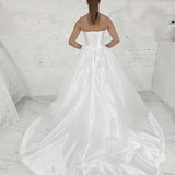 satin A-line wedding dress featuring a sculpted bodice, pearl waist detail, and timeless sophistication for hire