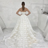 sparkling ivory lace wedding dress featuring a sweetheart neckline, corset back, and romantic ballgown silhouette