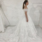 romantic white ballgown wedding dress adorned with floral lace, pearls, sparkle, and timeless elegance