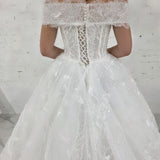 romantic white ballgown wedding dress adorned with floral lace, pearls, sparkle, and timeless elegance