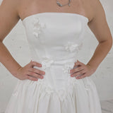 romantic satin wedding dress featuring a drop waist, 3D floral details, and timeless elegance for hire
