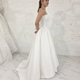 romantic satin wedding dress featuring a drop waist, 3D floral details, and timeless elegance for hire