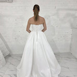 romantic satin wedding dress featuring a drop waist, 3D floral details, and timeless elegance for hire