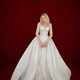 ballgown wedding dress with floral lace and dramatic detachable bow