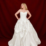 white ballgown with sculptural pleats, layered volume, and timeless couture elegance