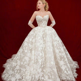 ballgown wedding dress with floral lace and detachable romantic sleeves.