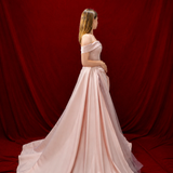 baby pink ballgown with elegant draping and a timeless silhouette.