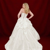 white ballgown with sculptural pleats, layered volume, and timeless couture elegance