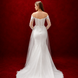 mermaid elegance with floral tulle sleeves and graceful draped details.