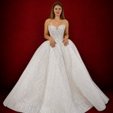 dazzling ballgown wedding dress featuring a crystal-encrusted bodice, glowing skirt, and regal elegance.