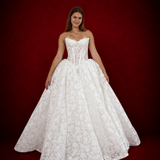 lace ballgown wedding dress featuring dramatic hips, corsetry, and timeless royal elegance