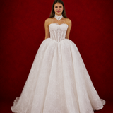 ballgown wedding dress featuring sparkling lace, dramatic hips, and an elegant neck cuff for hire
