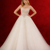 Light champagne wedding ballgown featuring a straight neckline, delicate beaded straps, sheer sparkling bodice, basque waistline, and corset back for hire