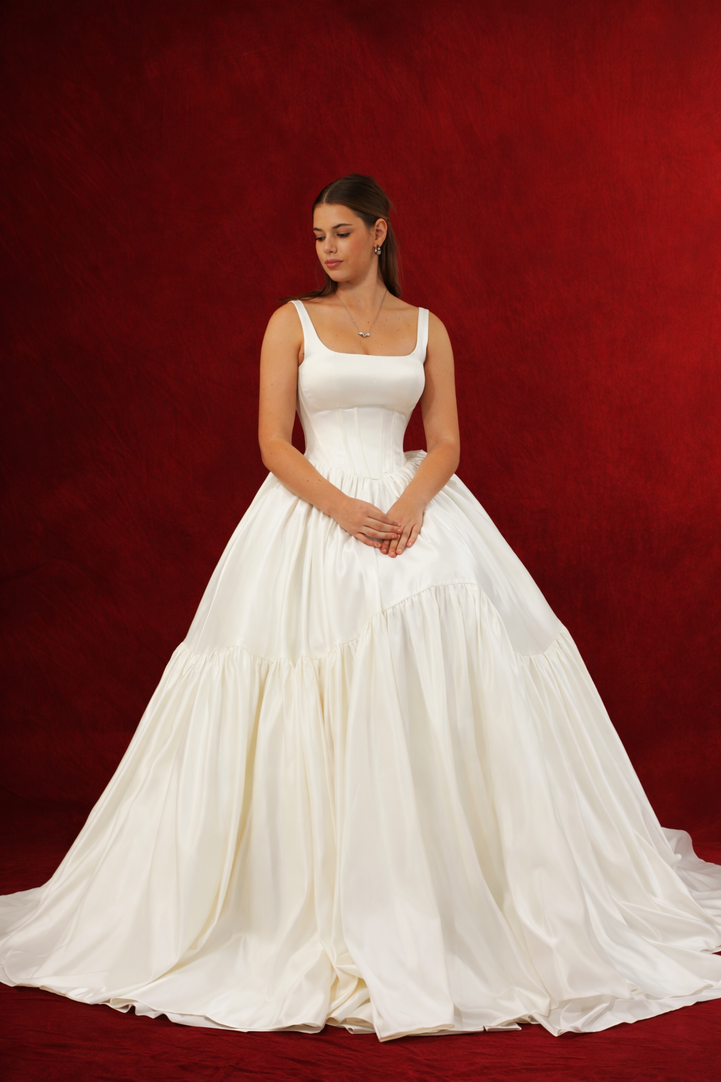 White wedding ballgown with straight neckline, basque waist, corset back, and layered skirt. 22 White wedding ballgown with straight neckline, basque waist, corset back, and layered skirt. 22