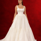 white wedding ballgown with straight neckline, basque waist, corset back, and layered skirt for hire