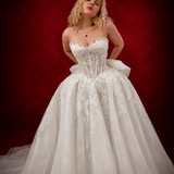 ballgown wedding dress with floral lace and dramatic detachable bow for hire