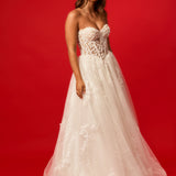 Sweetheart neckline with nude bodice and white lace wedding dress for hire.