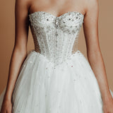 White sparkling corset princess dress with basque waist