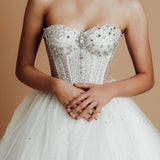 White sparkling corset princess dress with basque waist