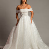 White sequins and beads all over the dress with off the shoulder sleeve