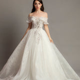 White wedding dress with asymmetrical bustier top and puffy layered skirt