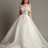 White wedding dress with asymmetrical bustier top and puffy layered skirt