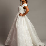 Off the shoulder lace all over ballgown wedding dress with a corset back