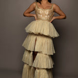 Sparkling gold tiered column dress with high slit for hire